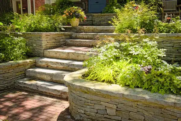 https://perenia.fr/wp-content/uploads/2026/06/depositphotos_4467602-stock-photo-natural-stone-landscaping-1.webp